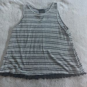 Knit tank with pom-pom detail. L.
